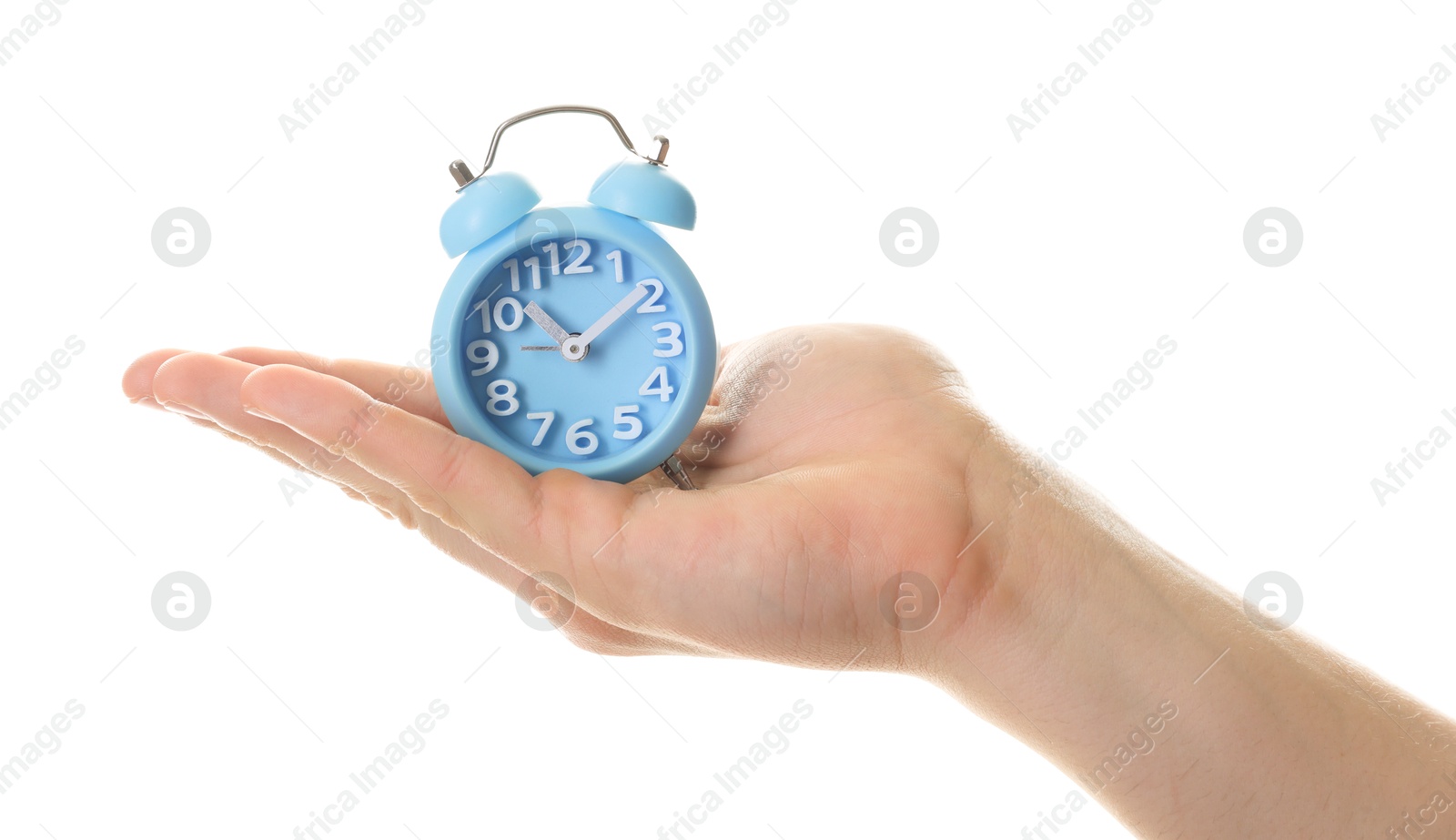 Photo of Man with light blue alarm clock on white background, closeup