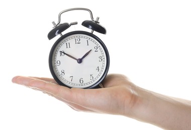 Photo of Man with black alarm clock on white background, closeup