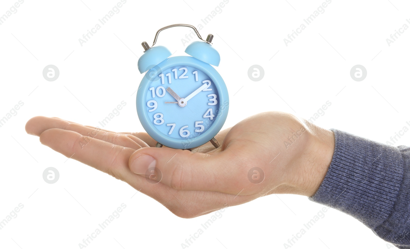 Photo of Man with light blue alarm clock on white background, closeup