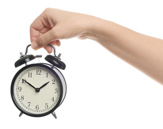 Woman with alarm clock on white background, closeup