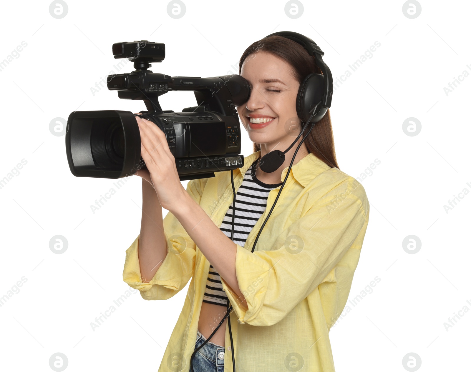 Photo of Happy woman with professional video camera and headset on white background