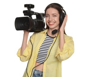 Photo of Happy woman with professional video camera and headset on white background