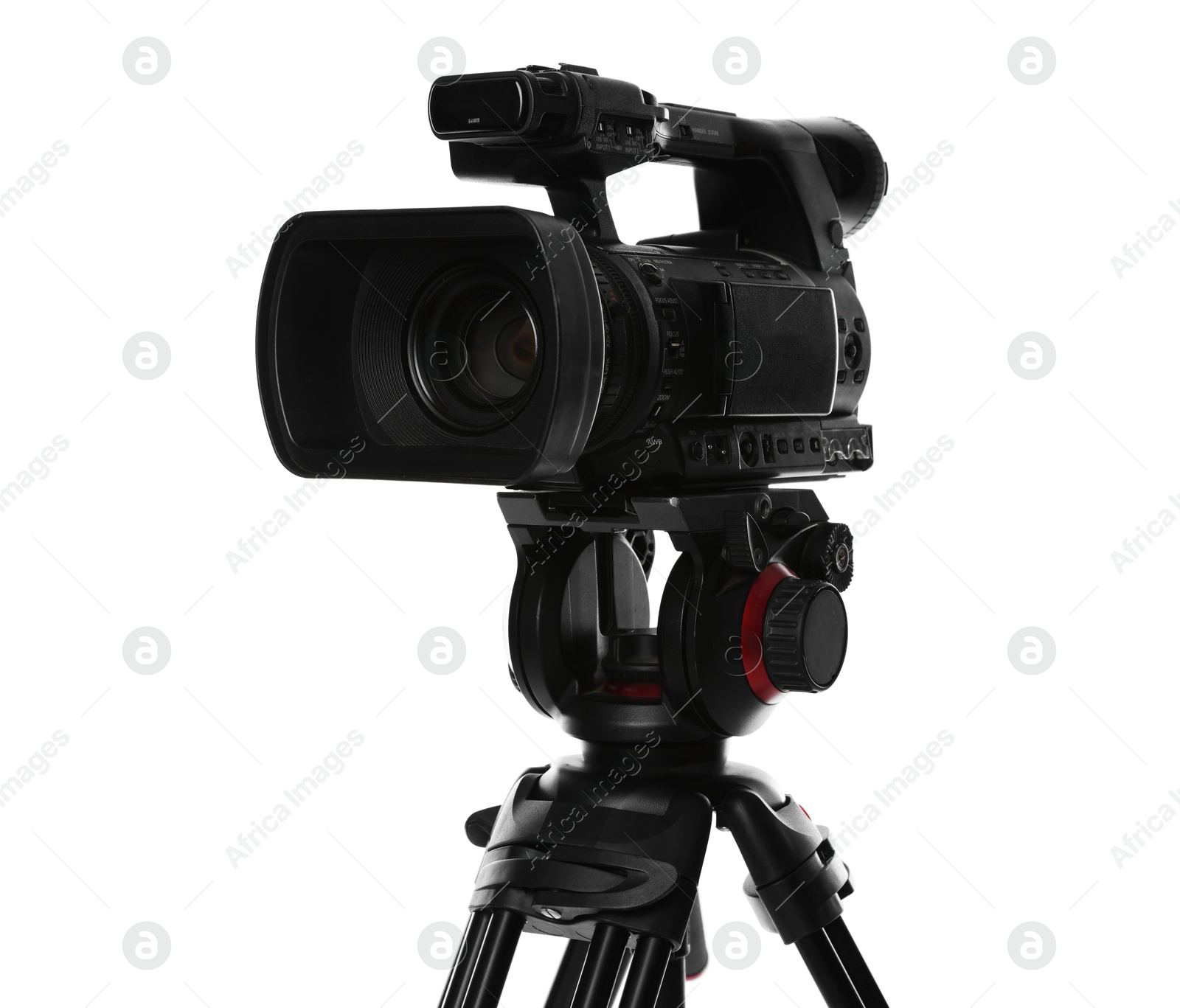 Photo of Modern video camera with tripod isolated on white