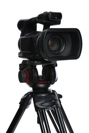 Photo of Modern video camera with tripod isolated on white