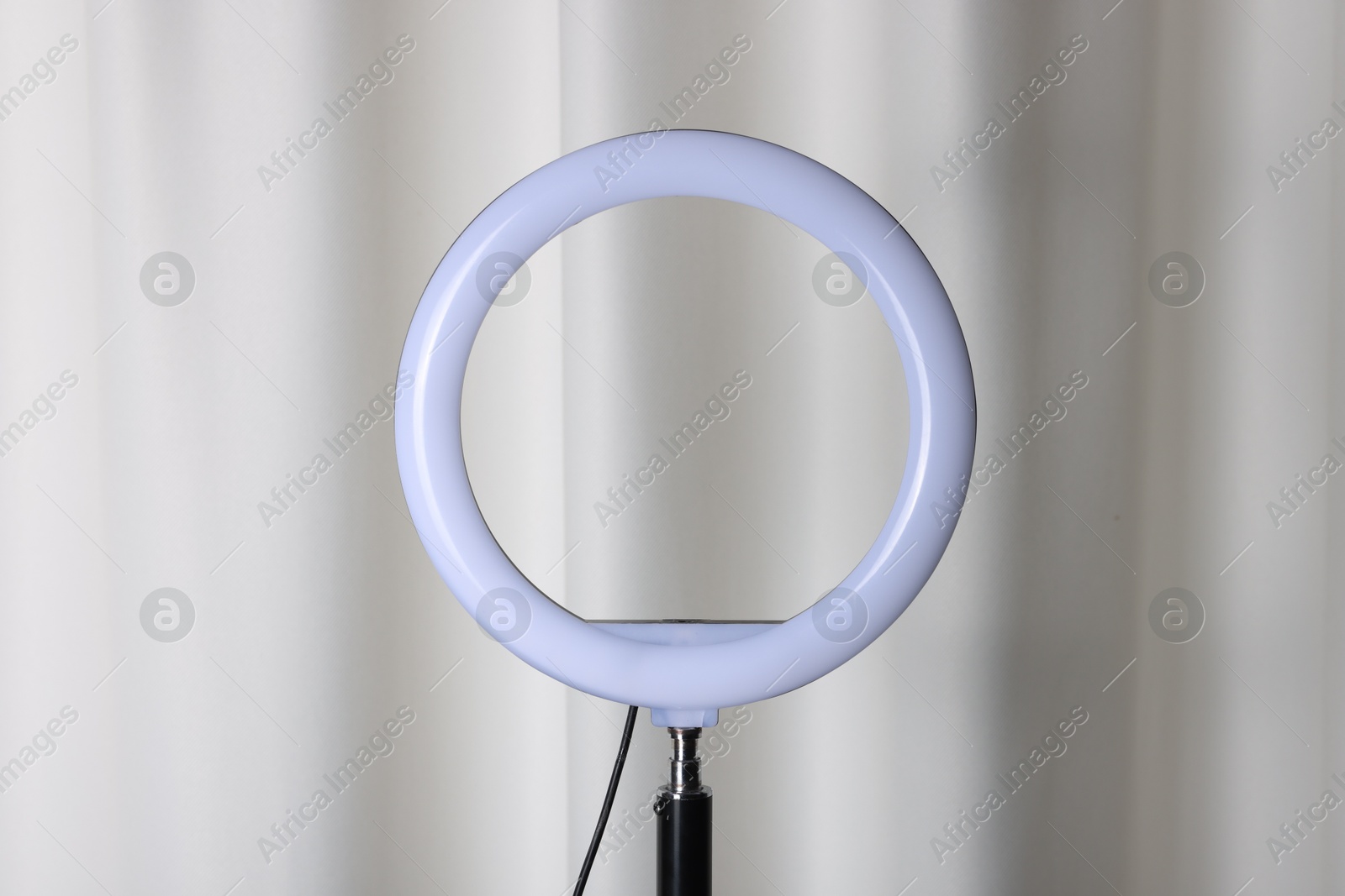 Photo of One ring lamp near light curtain. Photo and video equipment