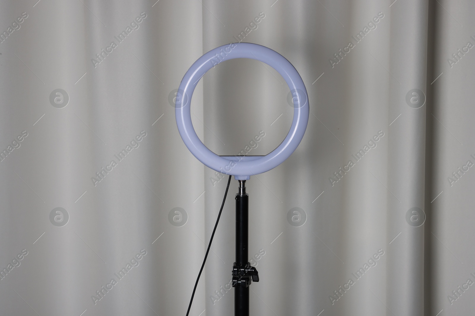 Photo of One ring lamp near light curtain. Photo and video equipment