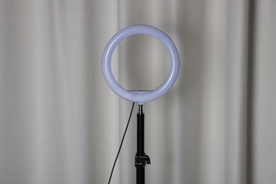 Photo of One ring lamp near light curtain. Photo and video equipment