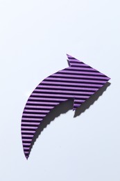 Photo of One purple paper arrow on white background, top view