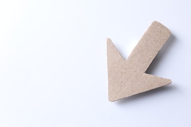 Photo of One kraft paper arrow on white background, top view. Space for text