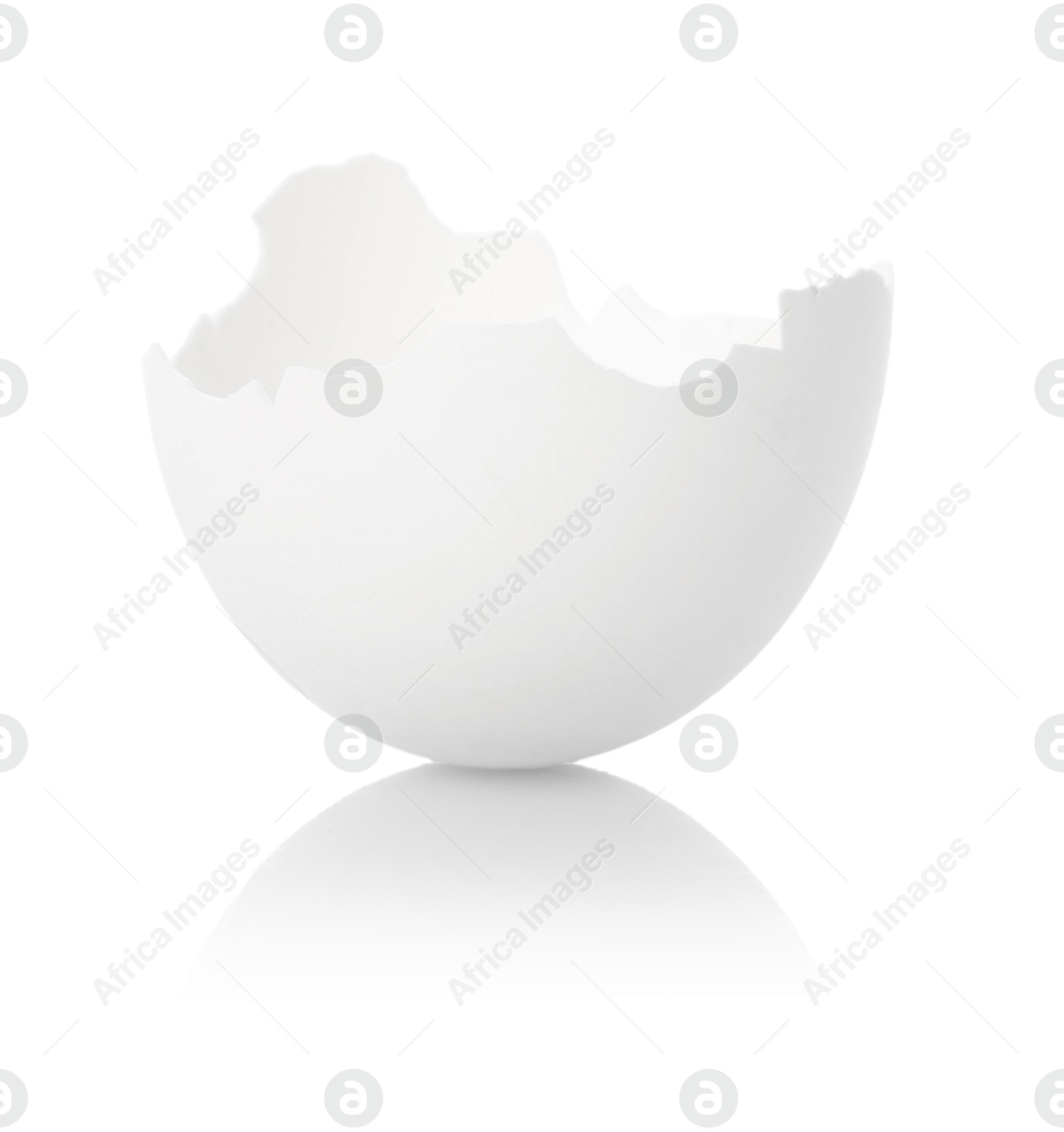 Photo of One piece of broken eggshell on mirror surface against white background