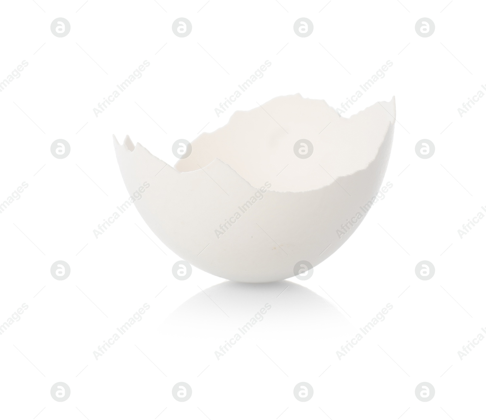 Photo of One piece of broken eggshell on mirror surface against white background