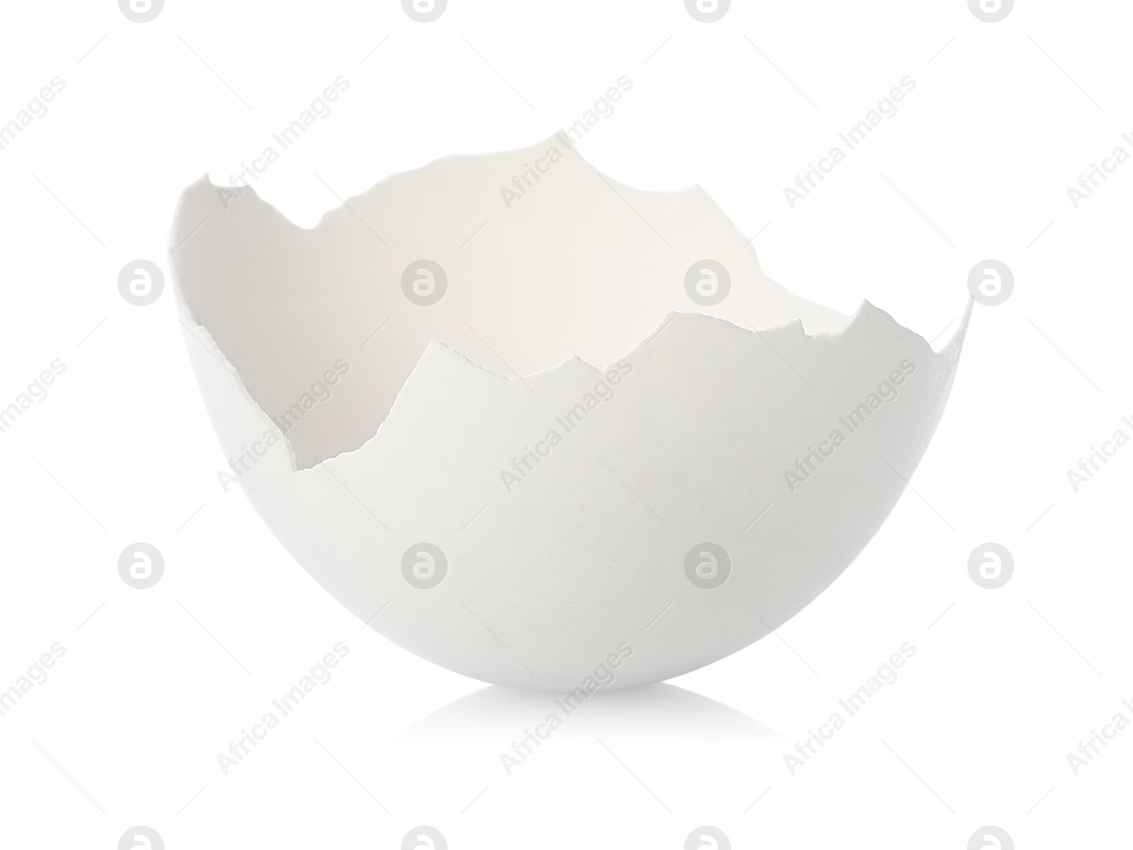 Photo of One piece of broken eggshell on mirror surface against white background