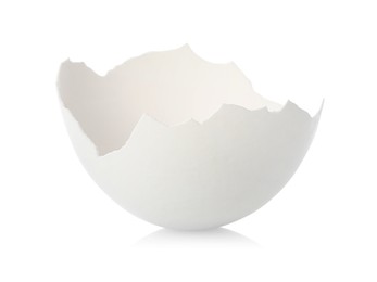 Photo of One piece of broken eggshell on mirror surface against white background