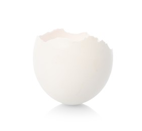 One piece of broken eggshell on mirror surface against white background