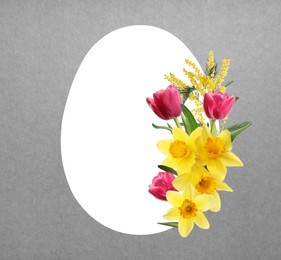 Image of Happy Easter greeting card. Egg-shaped outline with beautiful spring flowers on grey background