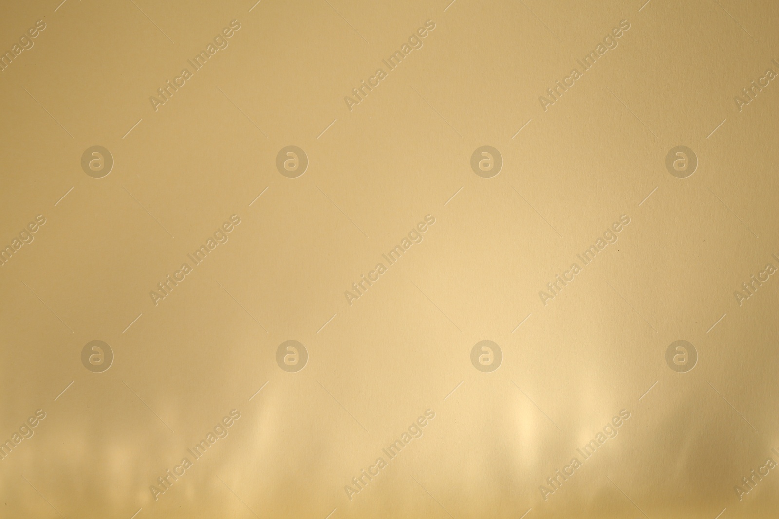 Photo of Light and shadows falling on beige background