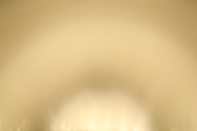 Photo of Light and shadows falling on beige background