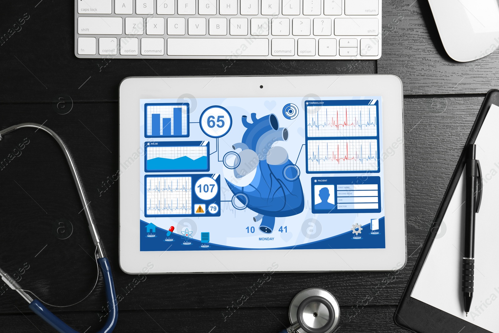 Image of Cardiology. Doctor's workplace with stethoscope and tablet computer on black wooden table, top view. Data on device screen