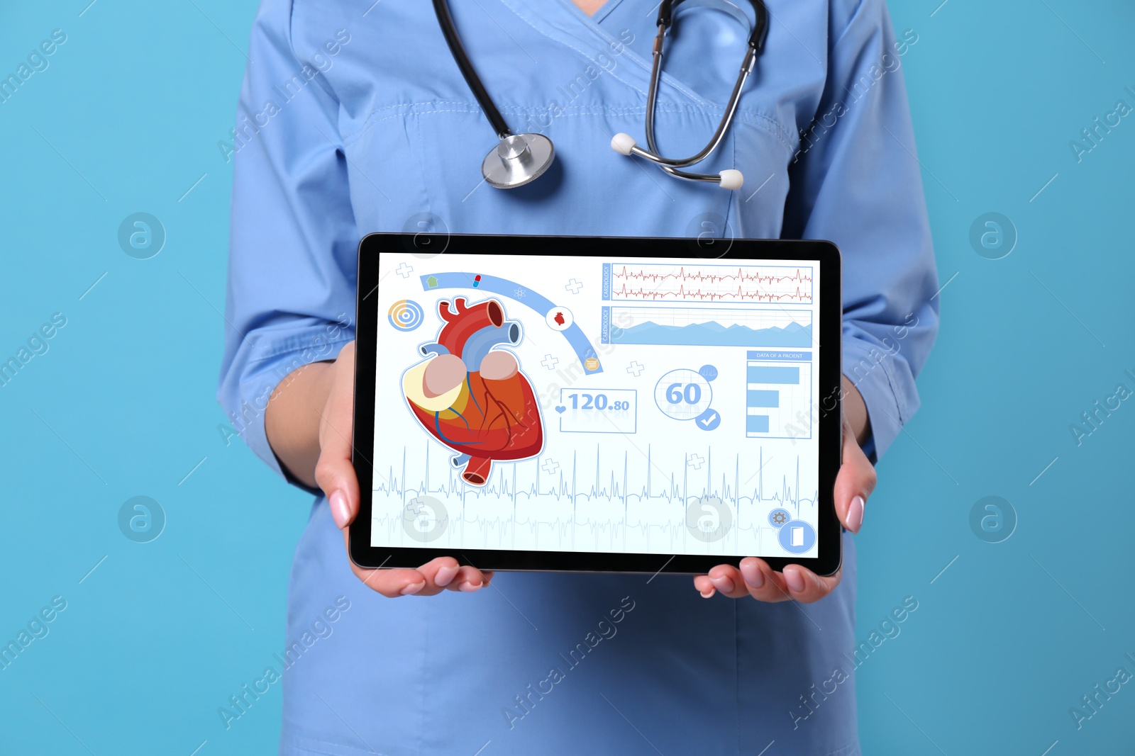 Image of Cardiology. Doctor holding tablet computer with data on screen against light blue background, closeup