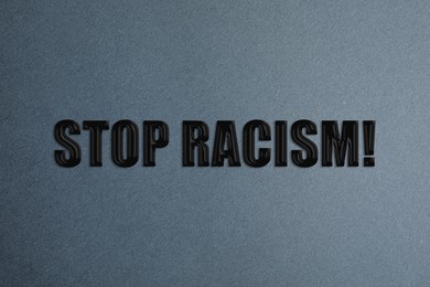 Image of Stop Racism! Black text on grey background