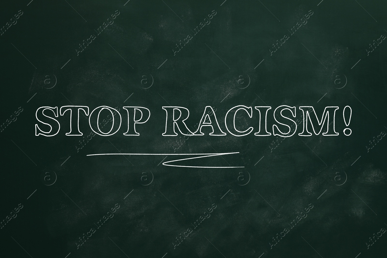 Image of Stop Racism! Text written on green chalkboard