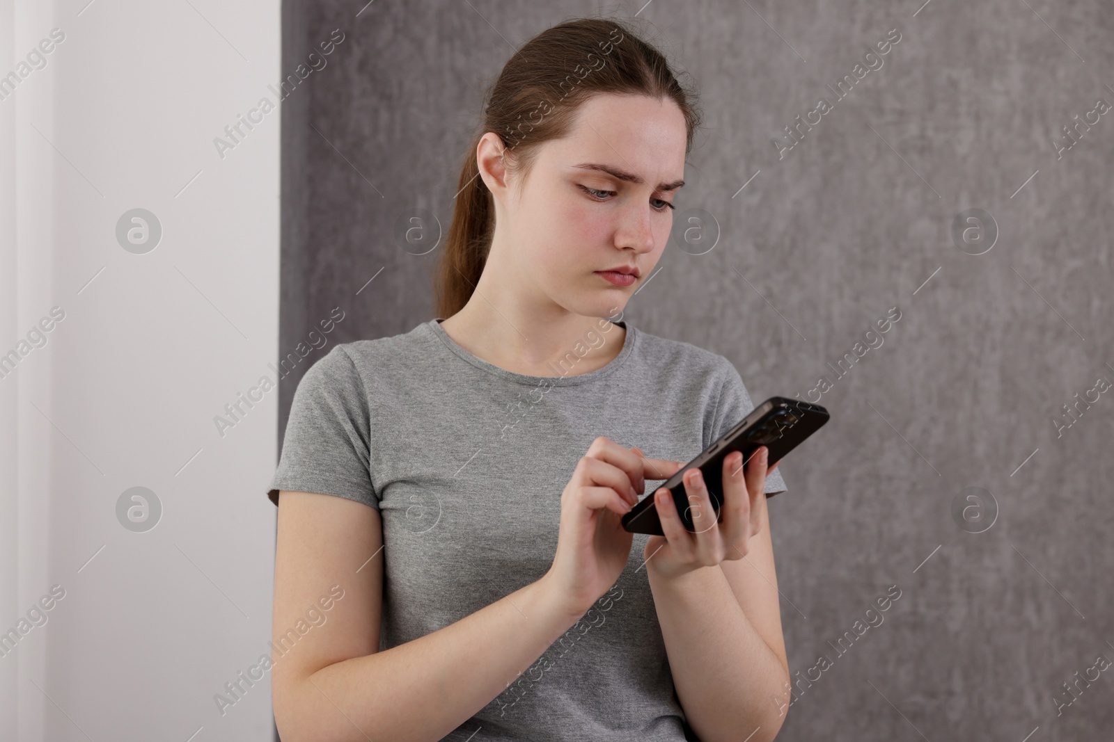 Photo of Stressed woman calling hotline for mental health help at home