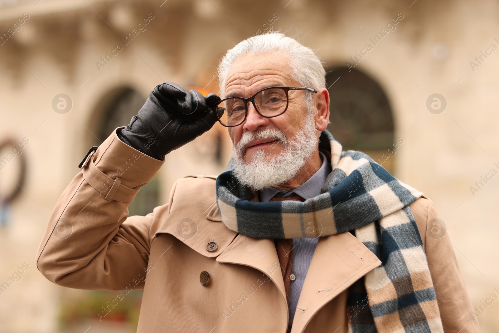 Photo of Stylish bearded senior man on city street