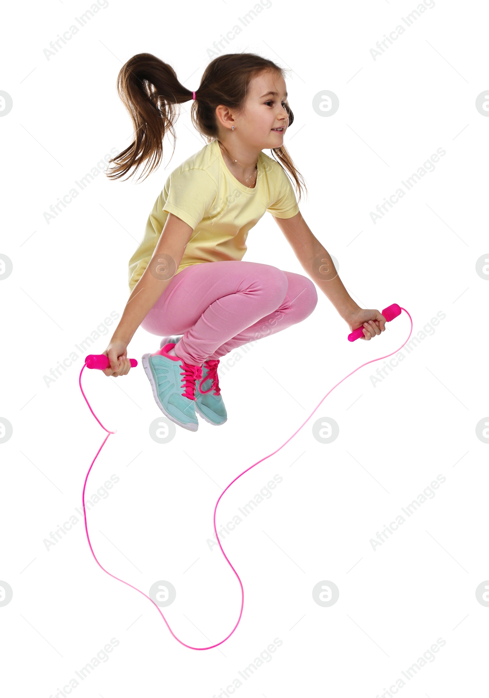 Photo of Cute little girl with jump rope on white background