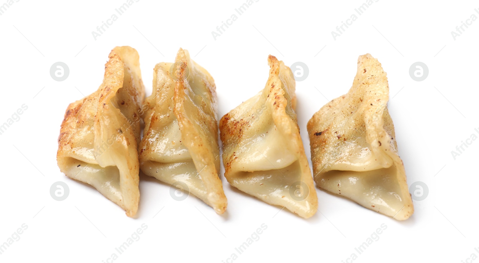 Photo of Tasty fried gyoza dumplings isolated on white