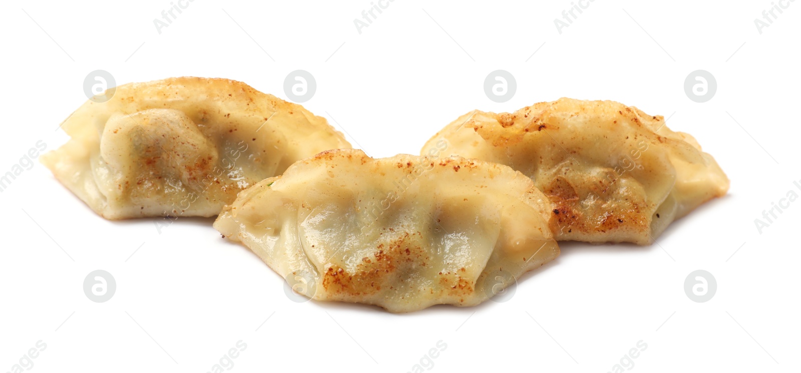 Photo of Tasty fried gyoza dumplings isolated on white