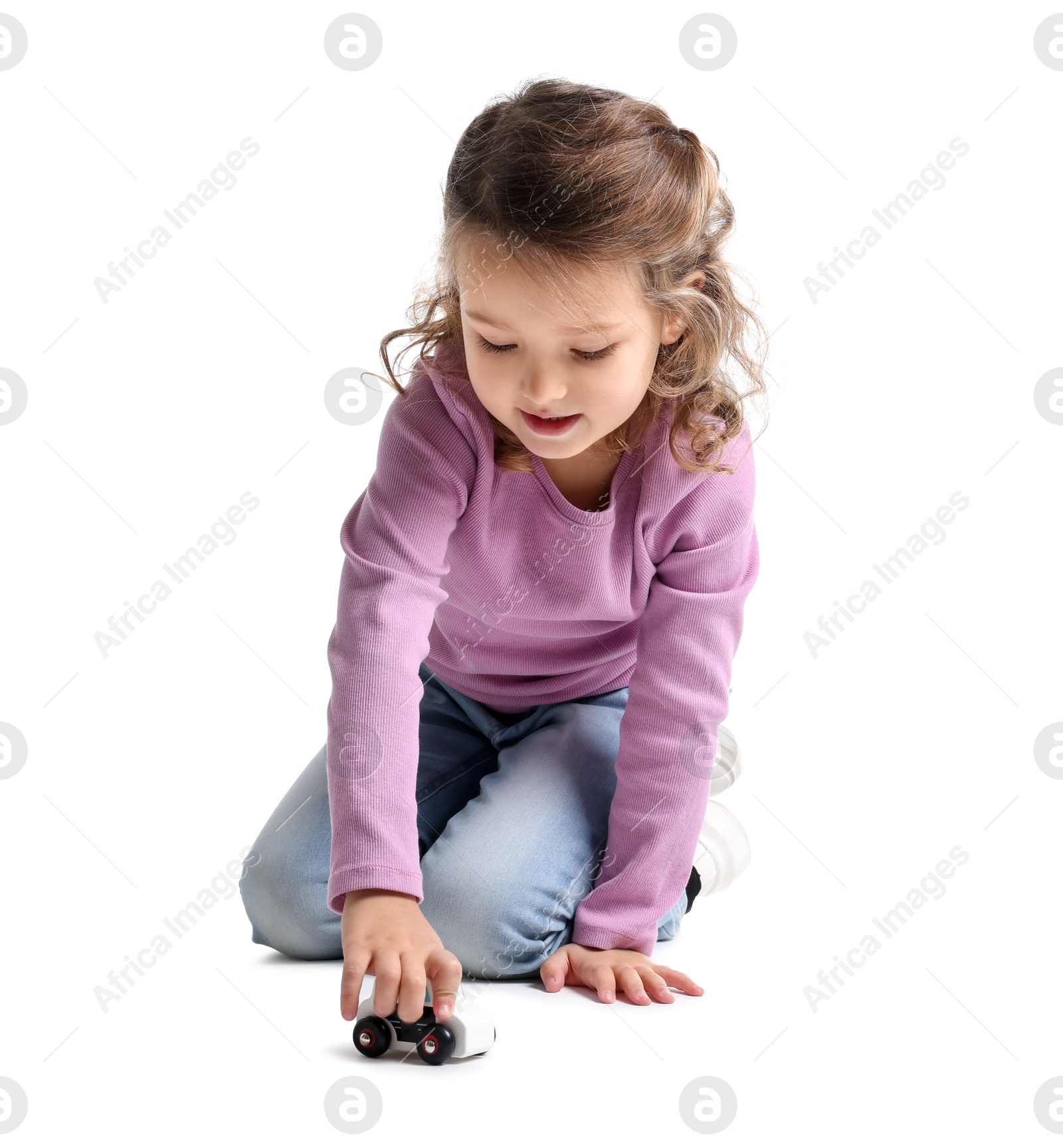 Photo of Little girl playing with toy car on white background