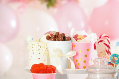 Photo of Candy bar. Many different sweets in festive decorated room, closeup