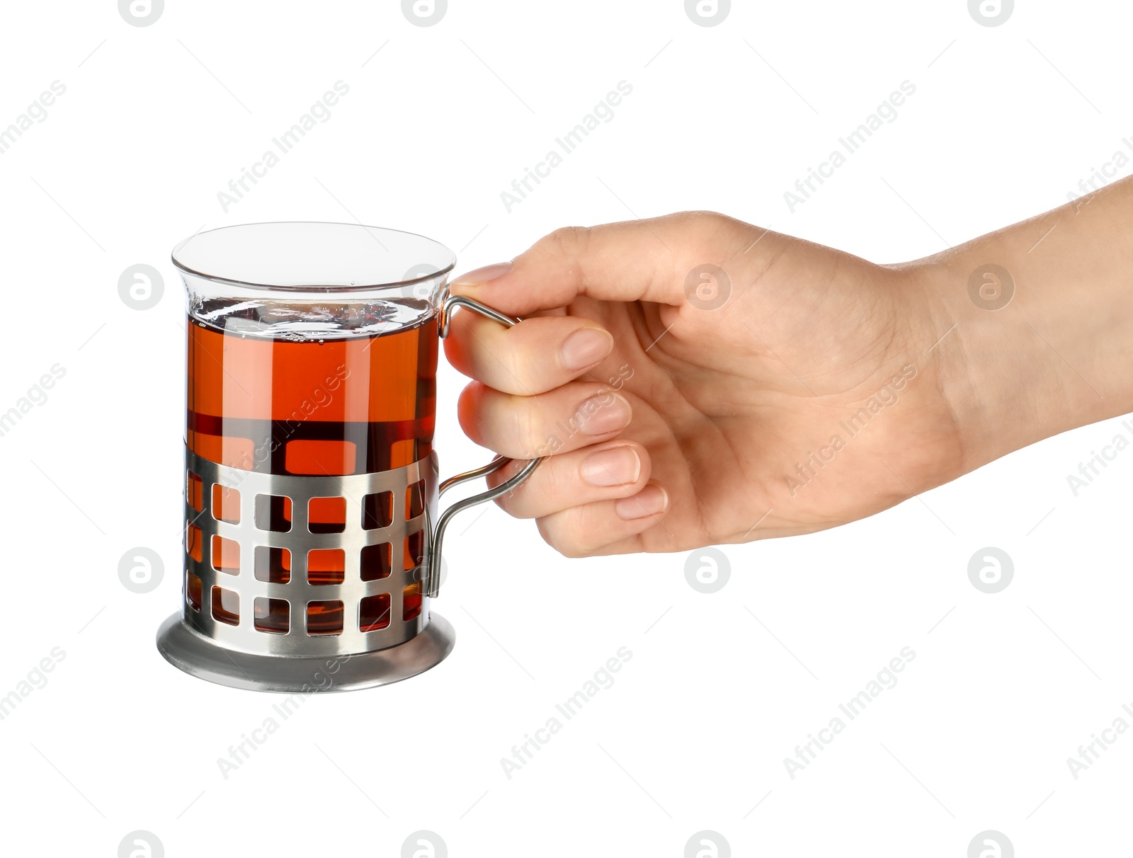 Photo of Woman holding glass of aromatic tea in holder on white background, closeup