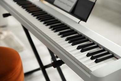 Photo of Synthesizer with black and white keys at home, closeup