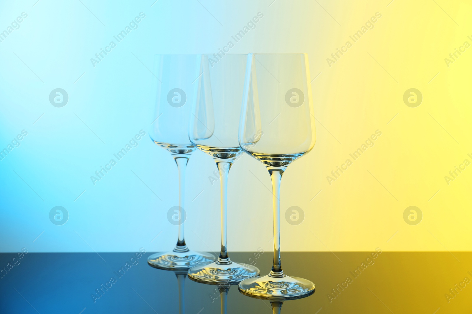 Photo of Empty glasses on table, color tone effect