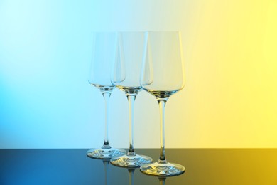 Photo of Empty glasses on table, color tone effect