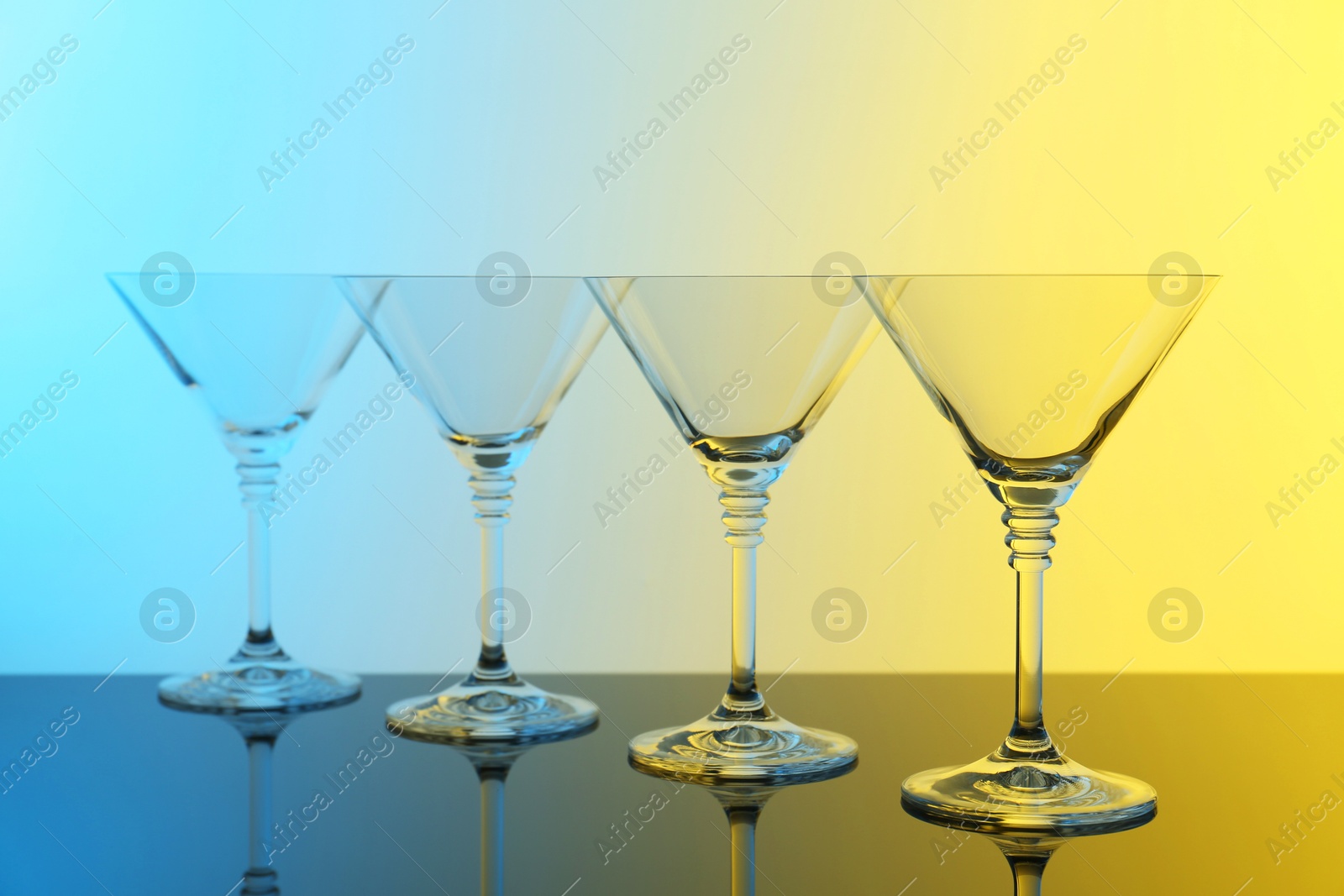 Photo of Empty glasses on table, color tone effect