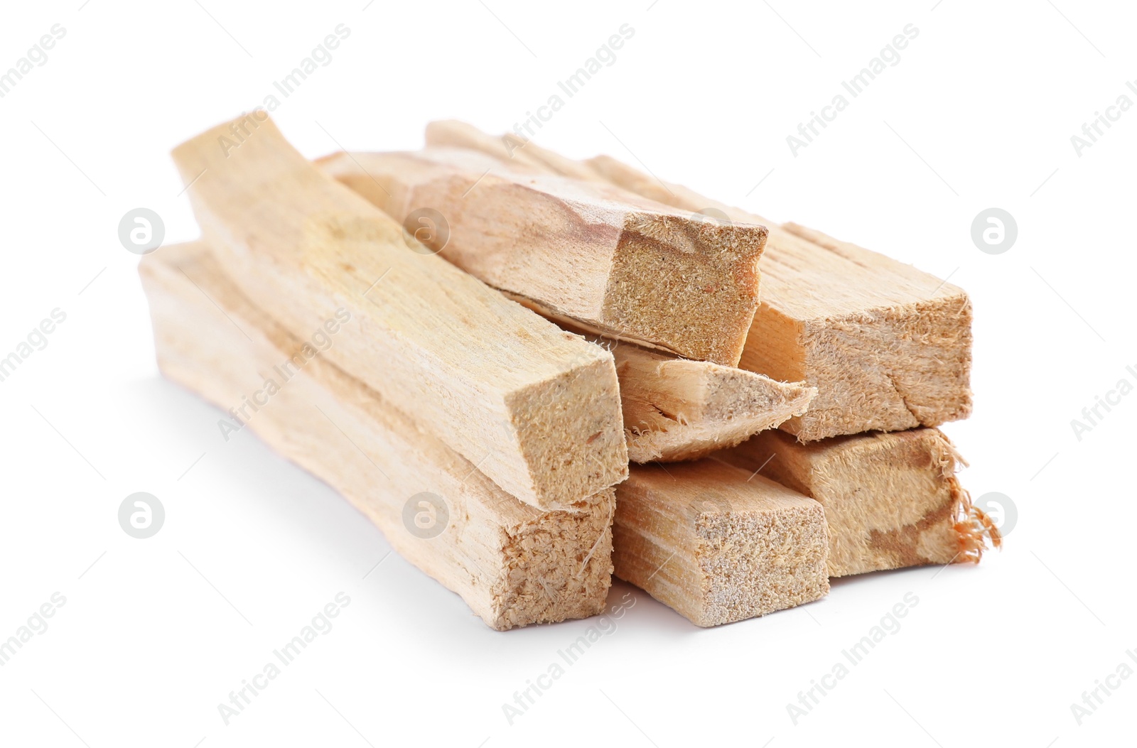 Photo of Pile of palo santo sticks on white background