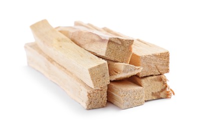 Photo of Pile of palo santo sticks on white background