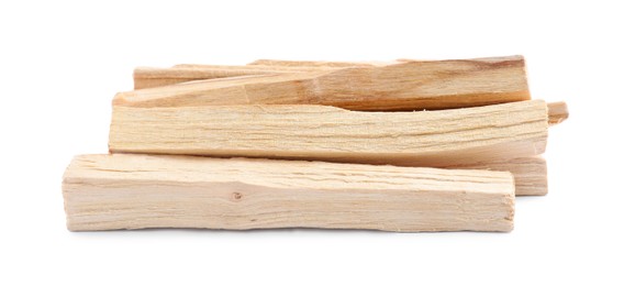 Pile of palo santo sticks on white background