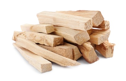 Photo of Pile of palo santo sticks on white background