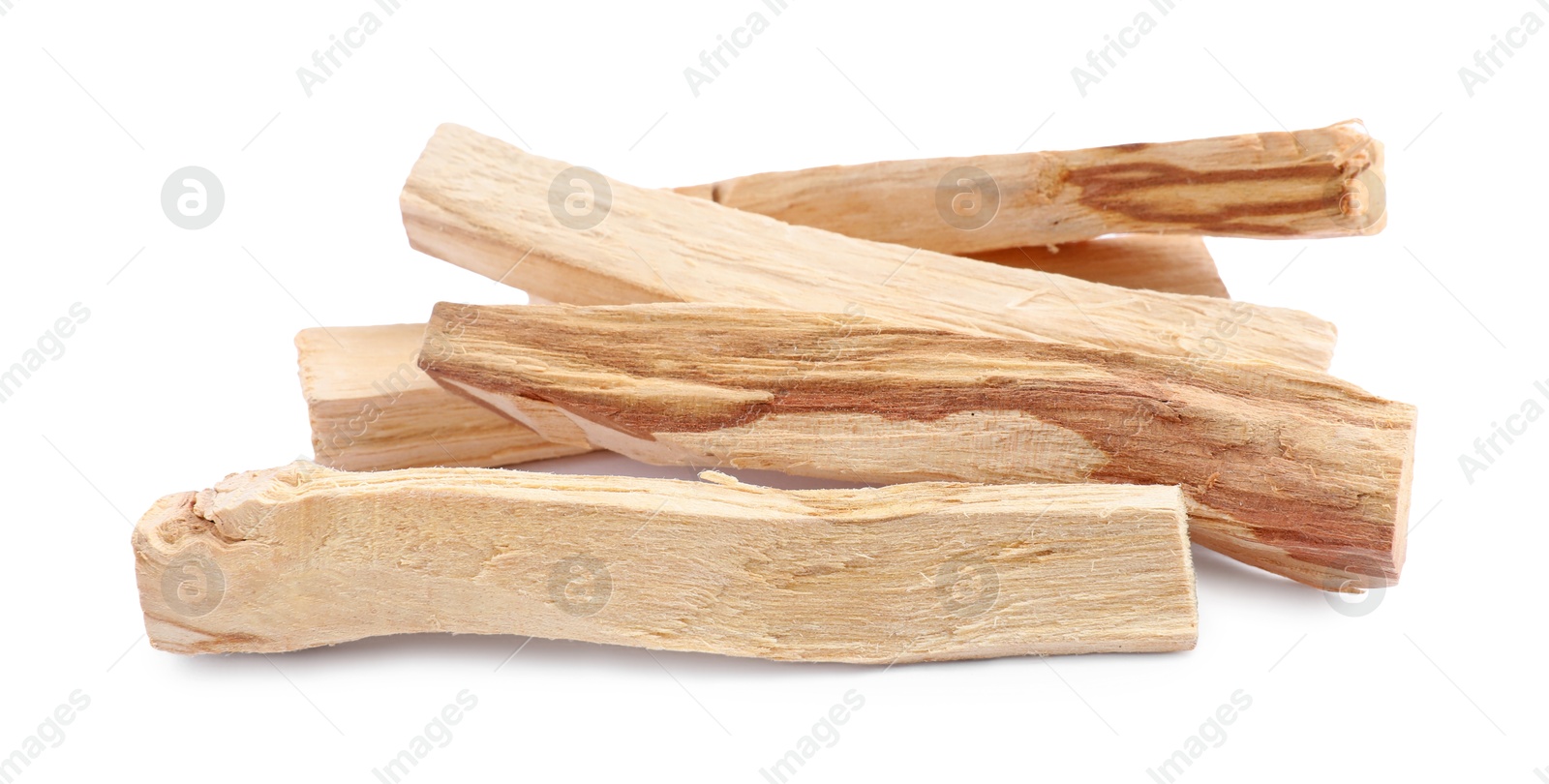 Photo of Pile of palo santo sticks on white background