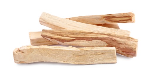 Photo of Pile of palo santo sticks on white background