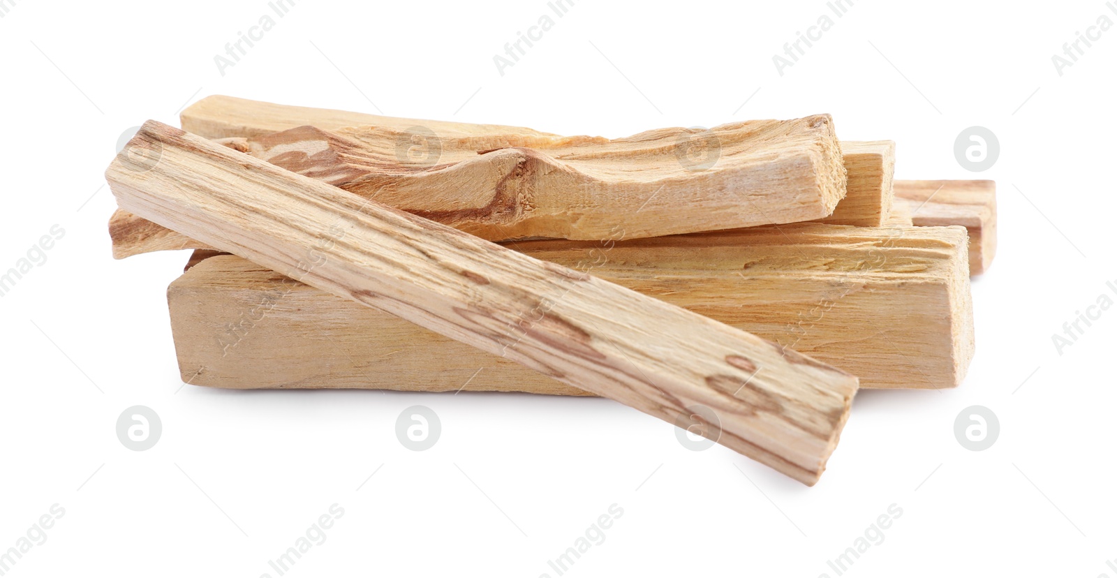 Photo of Pile of palo santo sticks on white background