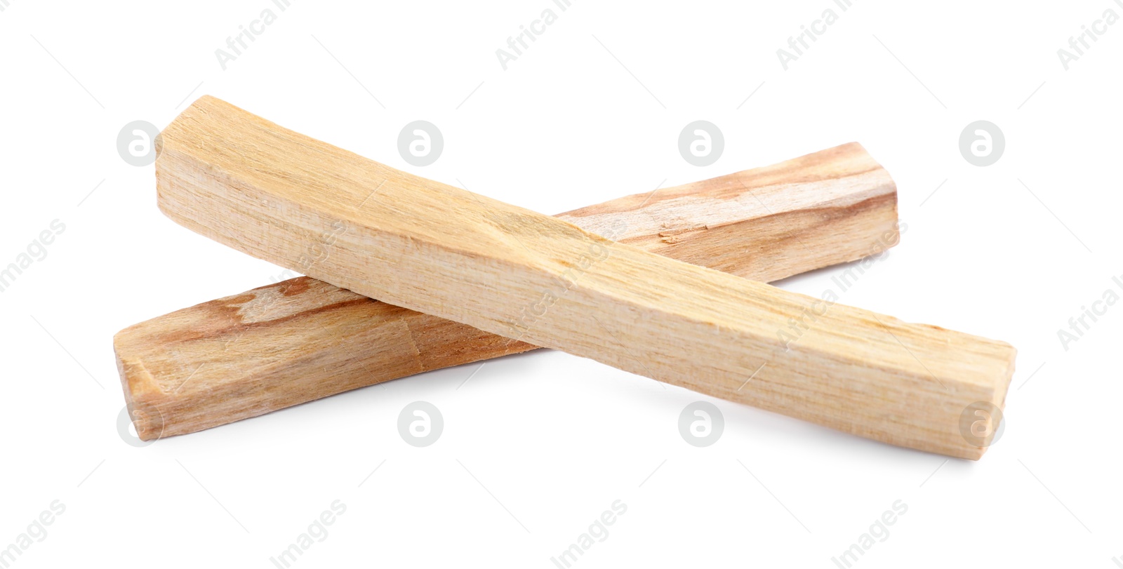 Photo of Two palo santo sticks on white background