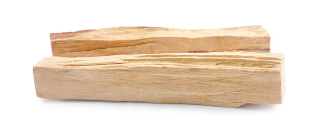 Photo of Two palo santo sticks on white background