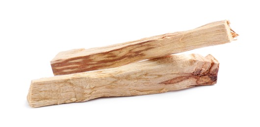 Photo of Two palo santo sticks on white background