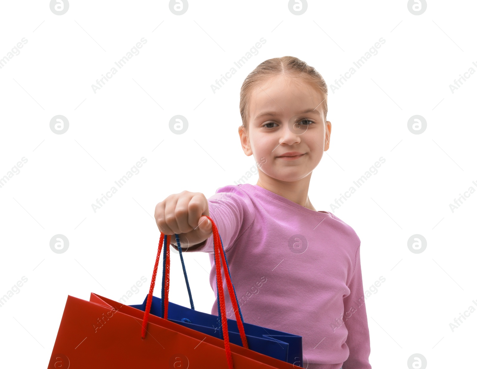 Photo of Cute little girl with shopping bags on white background