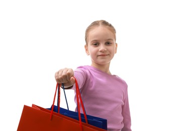 Photo of Cute little girl with shopping bags on white background