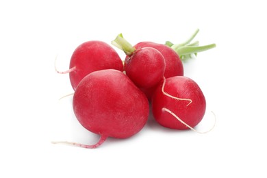 Photo of Many fresh ripe radishes isolated on white